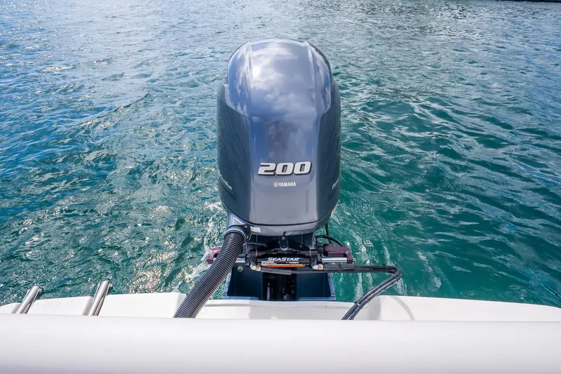 Slide: The Image of 2025 Sea Born LX22 Center Console with Yamaha 200 engine on water. - 21