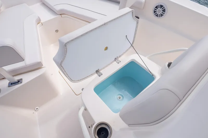 Slide: The Image of 2025 Sea Born LX22 Center Console boat interior with open storage compartment. - 30