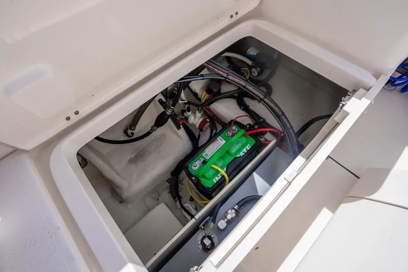 Slide: The Image of 2025 Sea Born LX22 Center Console battery compartment with wiring and components. - 39