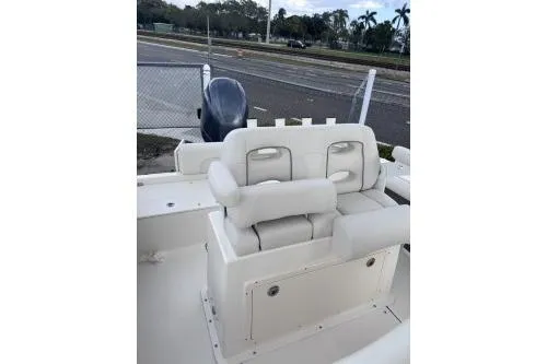 Slide: The Image of 2025 Sea Born LX22 Center Console boat with white seating and outboard motor. - 8