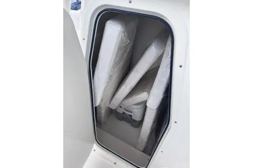 Slide: The Image of 2025 Sea Born LX22 Center Console storage compartment with cushions. - 9