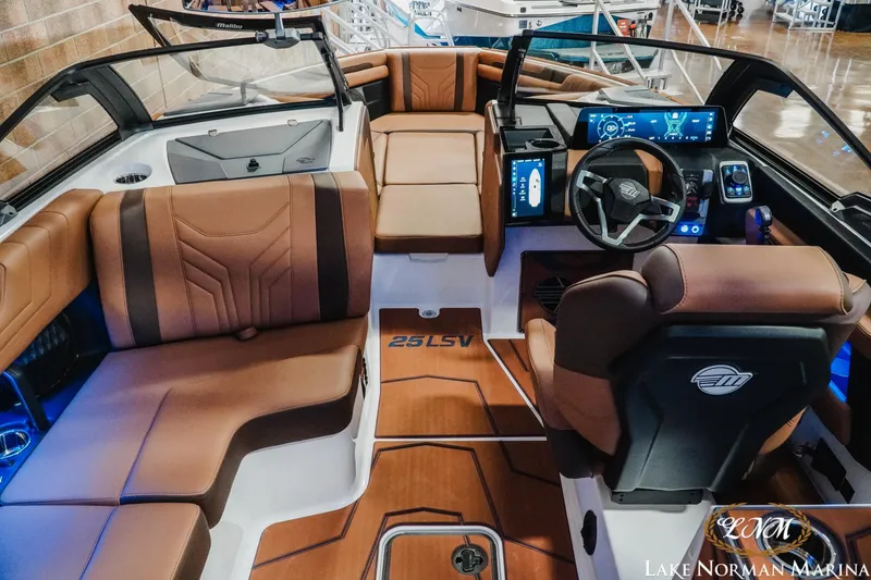 Slide: The Image of Luxurious interior of 2026 Malibu Wakesetter 25 LSV boat with modern dashboard and seating. - 13