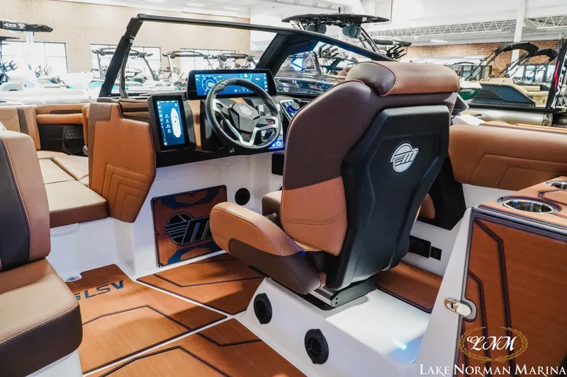 Slide: The Image of 2026 Malibu Wakesetter 25 LSV interior with modern dashboard and luxurious seating. - 14