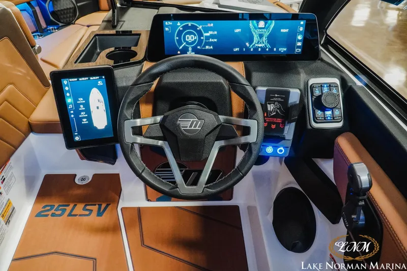 Slide: The Image of 2026 Malibu Wakesetter 25 LSV dashboard with advanced digital controls and steering wheel. - 15