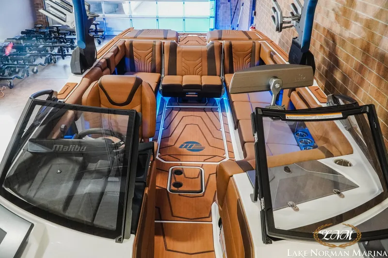 Slide: The Image of 2026 Malibu Wakesetter 25 LSV interior with luxurious seating and modern design at Lake Norman Marina. - 18