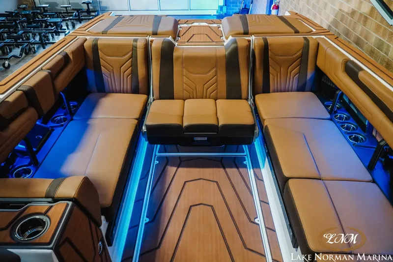 Slide: The Image of Luxurious interior of 2026 Malibu Wakesetter 25 LSV with brown seating and ambient lighting. - 20