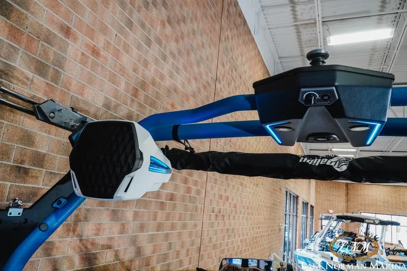 Slide: The Image of 2026 Malibu Wakesetter 25 LSV boat tower with speakers and LED lights in marina. - 21