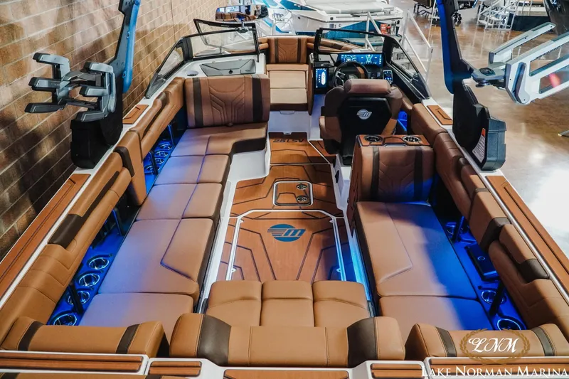 Slide: The Image of 2026 Malibu Wakesetter 25 LSV interior with luxurious seating and ambient lighting. - 9