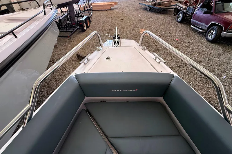 Slide: The Image of Axopar 28 Cabin 2022 in storage with gray seating. - 15
