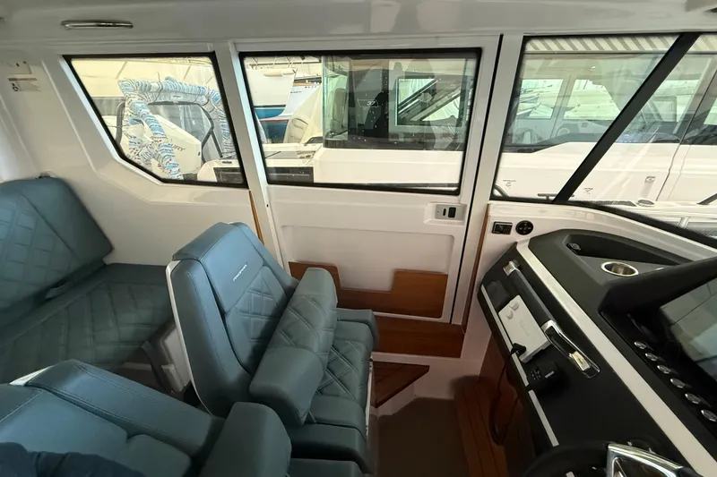 Slide: The Image of 2022 Axopar 28 Cabin bathroom with modern fixtures and sleek design. - 18