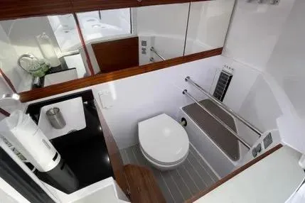Slide: The Image of Interior of 2022 Axopar 28 Cabin with luxurious seating and modern design. - 23