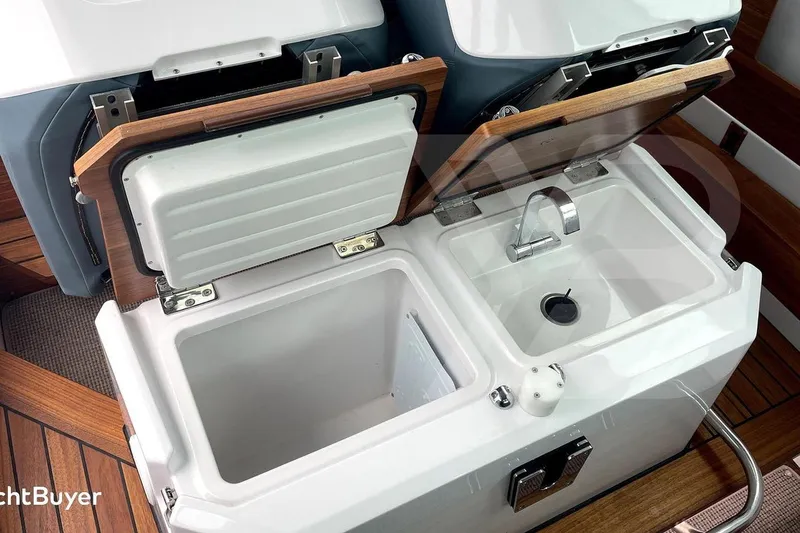 Slide: The Image of Interior view of 2022 Axopar 28 Cabin boat dashboard in a storage facility. - 25