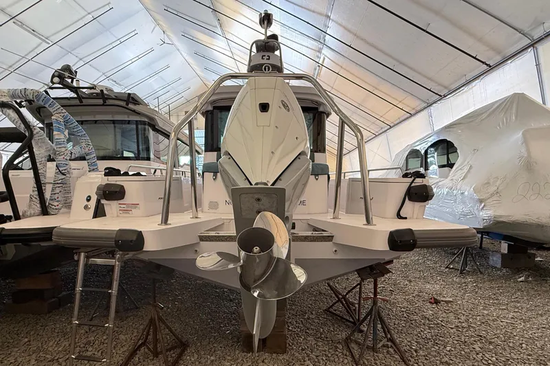 Slide: The Image of Axopar 28 Cabin 2022 in storage facility, rear view. - 7