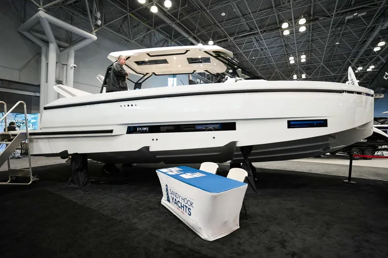 Slide: The Image of 2026 De Antonio Yachts D36 displayed at a boat show. - 2