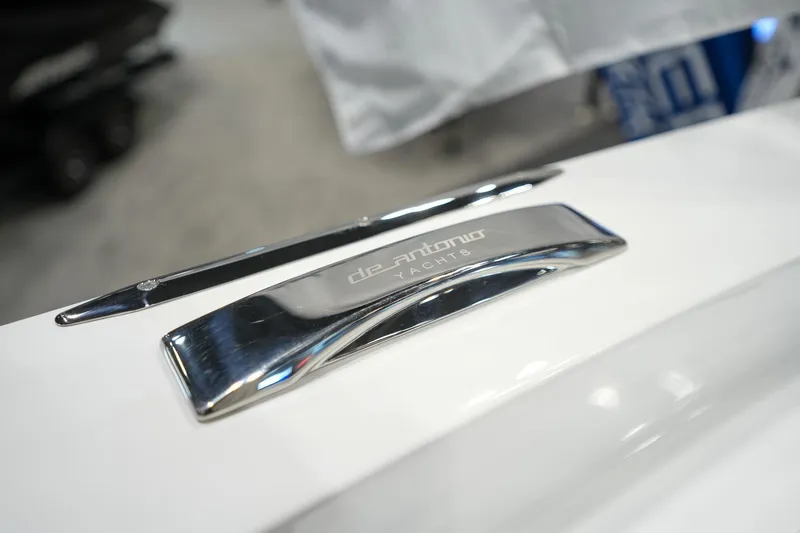 Slide: The Image of De Antonio Yachts D36 2026, close-up of logo on white surface. - 26