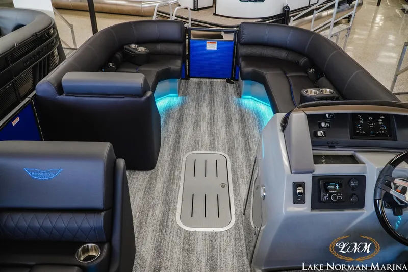 Slide: The Image of 2026 Bennington 23LSB pontoon boat interior with modern seating and ambient lighting. - 10