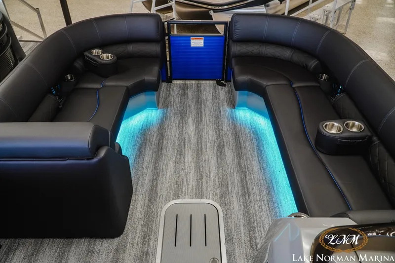 Slide: The Image of 2026 Bennington 23LSB boat interior with LED lighting and luxurious seating at Lake Norman Marina. - 12