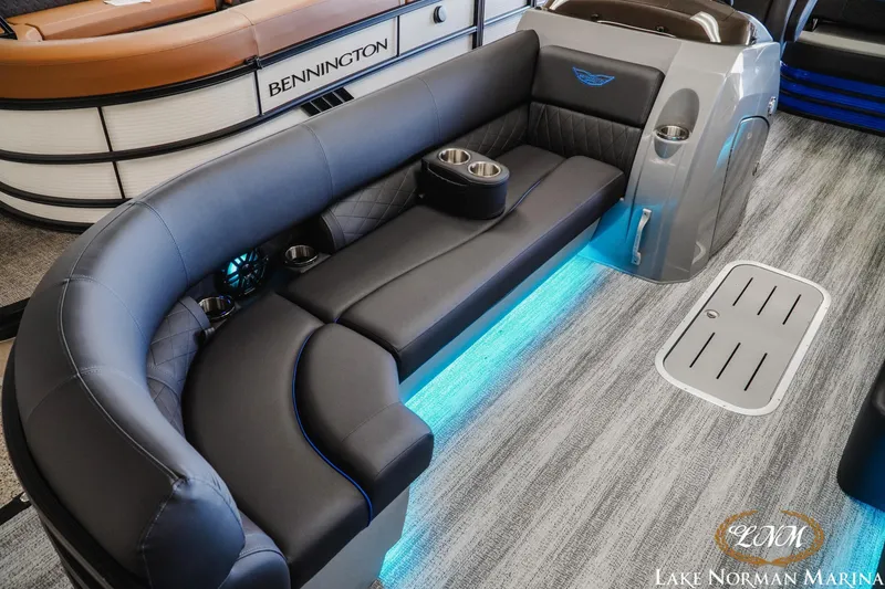 Slide: The Image of Luxurious interior of 2026 Bennington 23LSB pontoon boat with LED lighting and plush seating. - 19