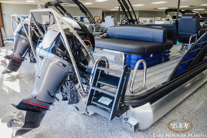 Slide: The Image of 2026 Bennington 23LSB pontoon boat with Yamaha outboard motors at Lake Norman Marina. - 3