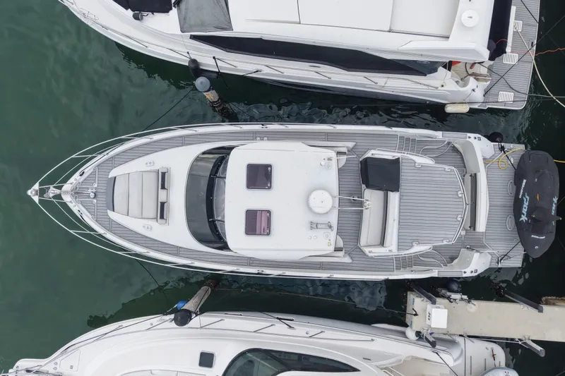 Slide: The Image of Overhead view of a 2009 Carver 44 Sojourn yacht docked at a marina. - 2