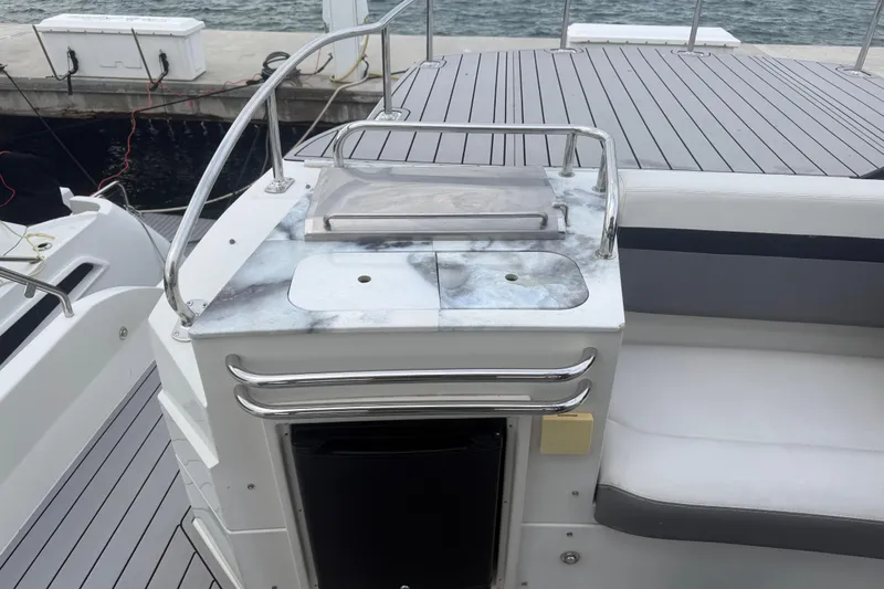 Slide: The Image of 2009 Carver 44 Sojourn yacht deck with sink and seating area. - 25