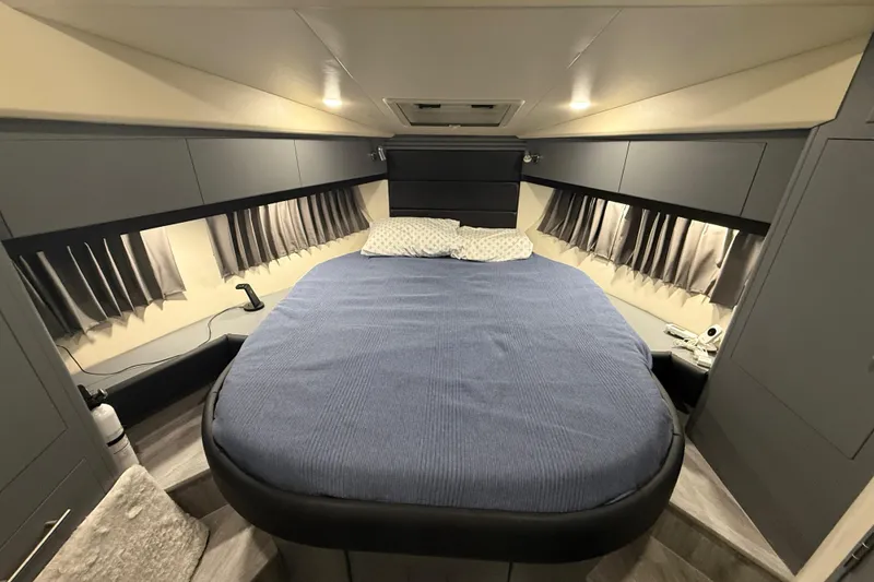 Slide: The Image of Luxurious bedroom interior of 2009 Carver 44 Sojourn yacht with cozy bed and modern design. - 37