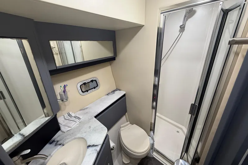 Slide: The Image of Bathroom interior of 2009 Carver 44 Sojourn yacht with shower, sink, and toilet. - 41