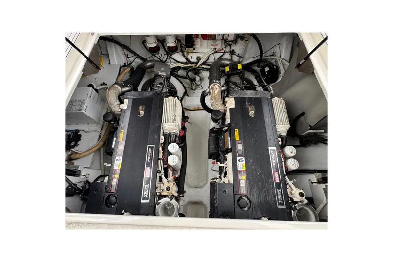 Slide: The Image of Engine compartment of a 2009 Carver 44 Sojourn yacht, featuring dual engines. - 44