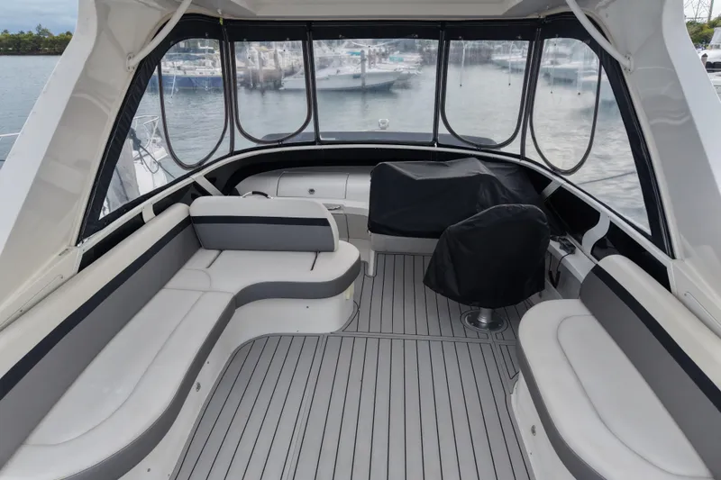 Slide: The Image of 2009 Carver 44 Sojourn yacht interior with sleek seating and panoramic windows. - 11