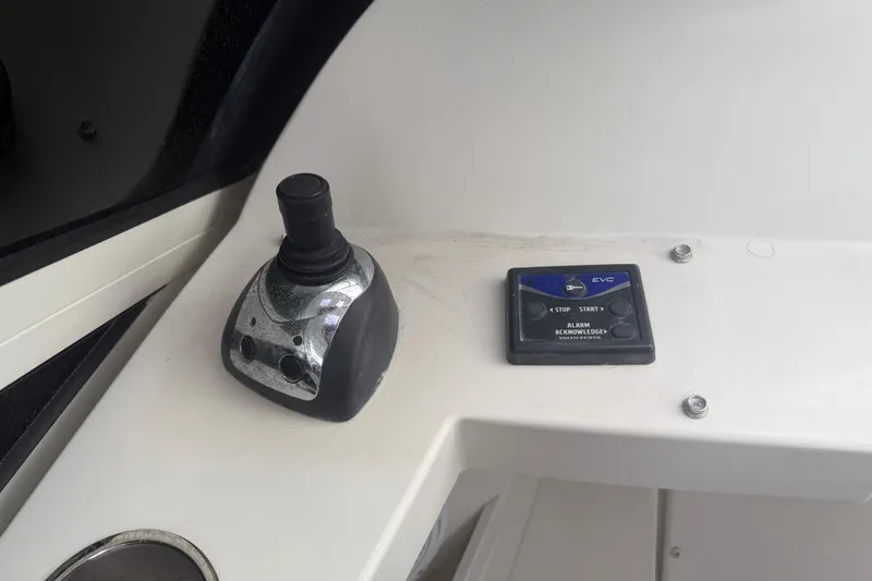 Slide: The Image of Control panel of a 2009 Carver 44 Sojourn boat with joystick and EVC system. - 18