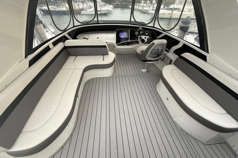 Slide: The Image of 2009 Carver 44 Sojourn yacht interior with sleek seating and modern helm. - 21