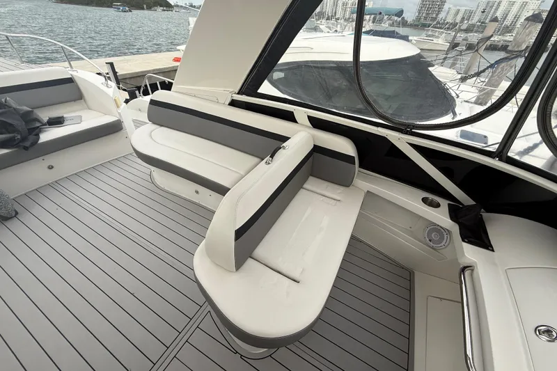 Slide: The Image of 2009 Carver 44 Sojourn yacht interior with sleek seating and modern design. - 22