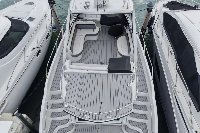 Slide: The Image of Top view of a 2009 Carver 44 Sojourn yacht docked between two boats. - 8