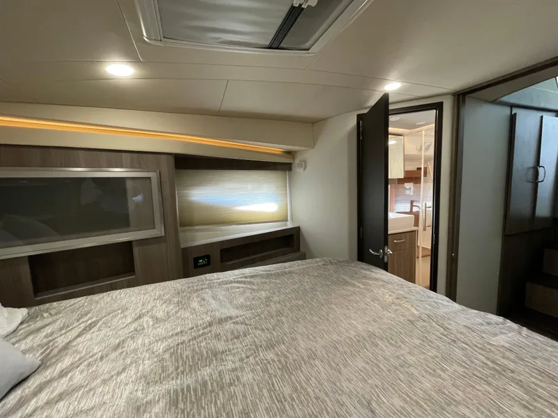 Slide: The Image of Luxurious interior of 2022 Regal 42 FXO yacht bedroom with modern design. - 20