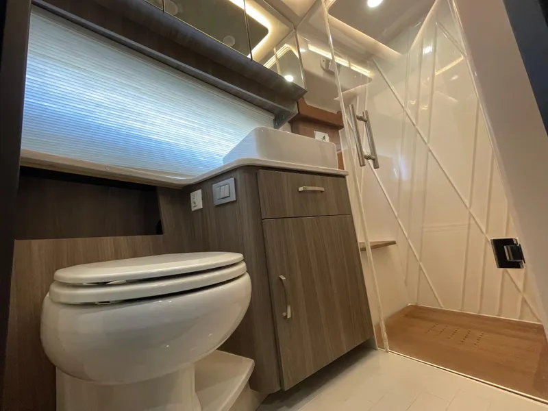 Slide: The Image of Luxurious bathroom in 2022 Regal 42 FXO yacht with modern fixtures and shower. - 23
