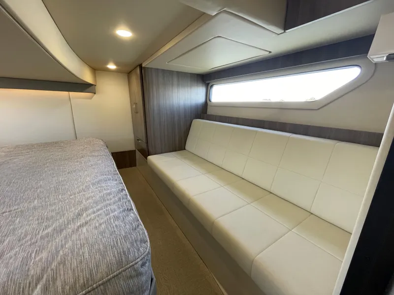 Slide: The Image of Interior of 2022 Regal 42 FXO yacht with modern seating and bed. - 29
