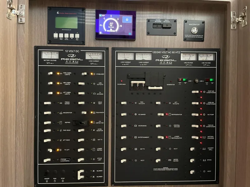 Slide: The Image of Electrical control panel of a 2022 Regal 42 FXO boat. - 32