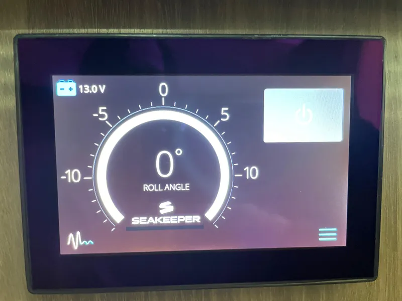 Slide: The Image of Seakeeper control display on 2022 Regal 42 FXO showing roll angle at 0 degrees. - 33