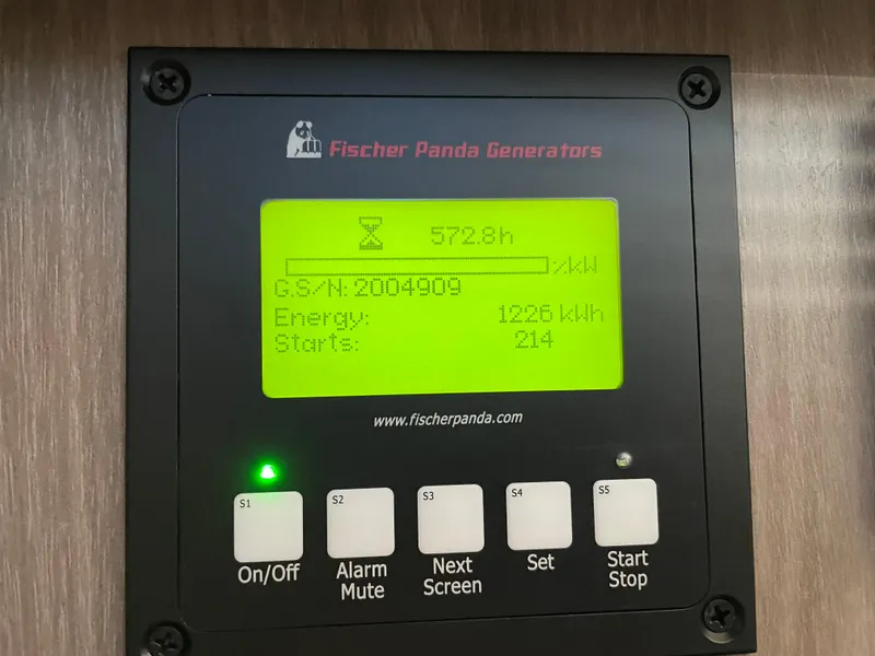 Slide: The Image of Fischer Panda generator display on Regal 42 FXO, showing 572.8 hours and 1226 kWh energy usage. - 34