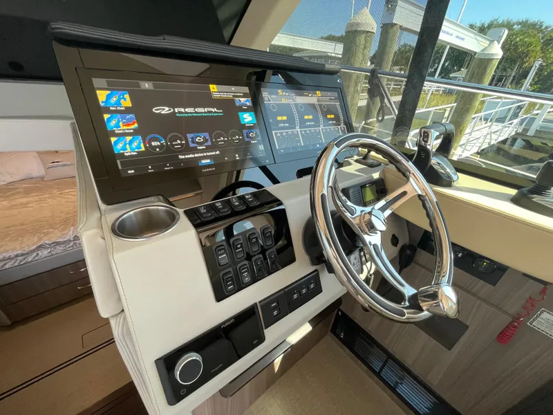Slide: The Image of 2022 Regal 42 FXO helm with modern controls and touchscreen displays. - 35