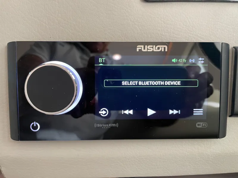 Slide: The Image of Fusion audio system display on 2022 Regal 42 FXO, showing Bluetooth device selection. - 37