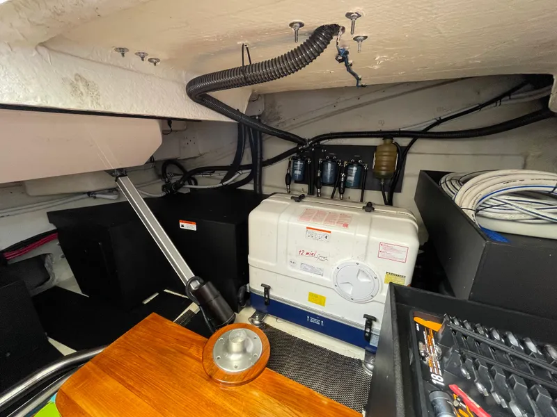 Slide: The Image of Engine room of 2022 Regal 42 FXO boat with mechanical components and wiring. - 45