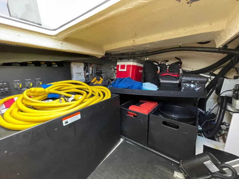 Slide: The Image of Storage area in 2022 Regal 42 FXO boat with equipment and supplies. - 46