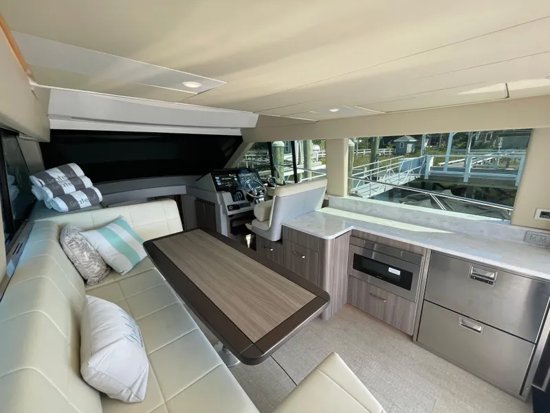 Slide: The Image of Luxurious interior of 2022 Regal 42 FXO yacht with modern seating and helm. - 7