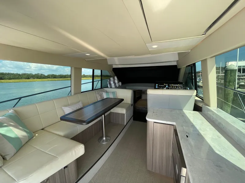 Slide: The Image of Luxurious interior of 2022 Regal 42 FXO yacht with elegant seating and scenic views. - 8