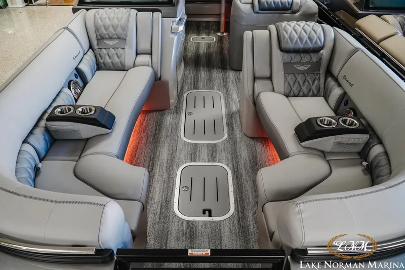 Slide: The Image of Luxurious interior of 2026 Bennington 25QSBA pontoon boat with plush seating and cup holders. - 14