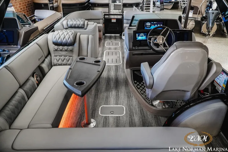 Slide: The Image of Luxurious interior of 2026 Bennington 25QSBA pontoon boat with modern seating and helm. - 8