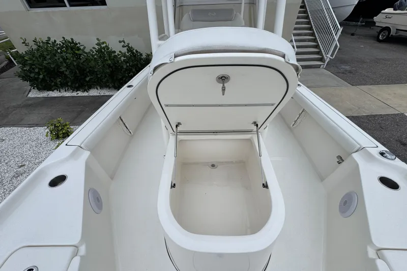 Slide: The Image of 2024 Key West 250 Bay Reef boat with open storage compartment on deck. - 12