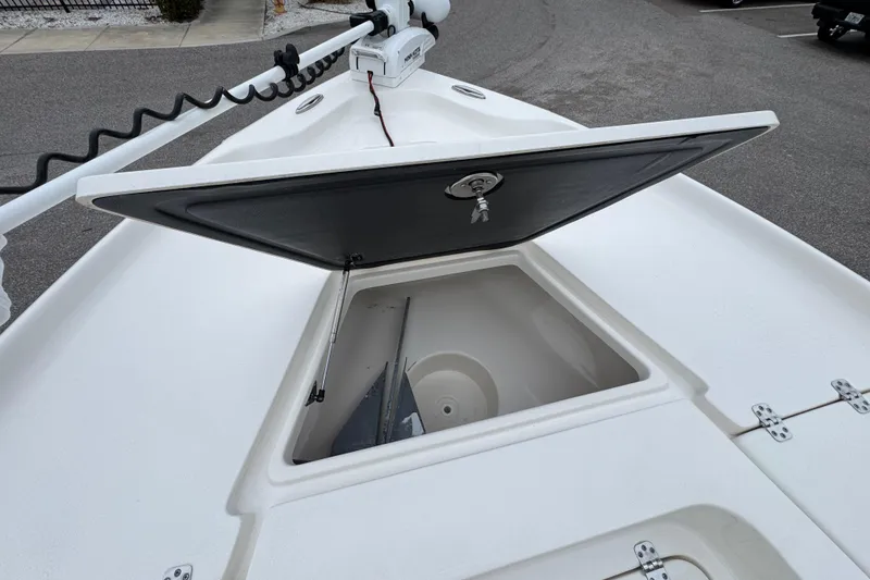Slide: The Image of 2024 Key West 250 Bay Reef boat with open storage compartment on deck. - 7