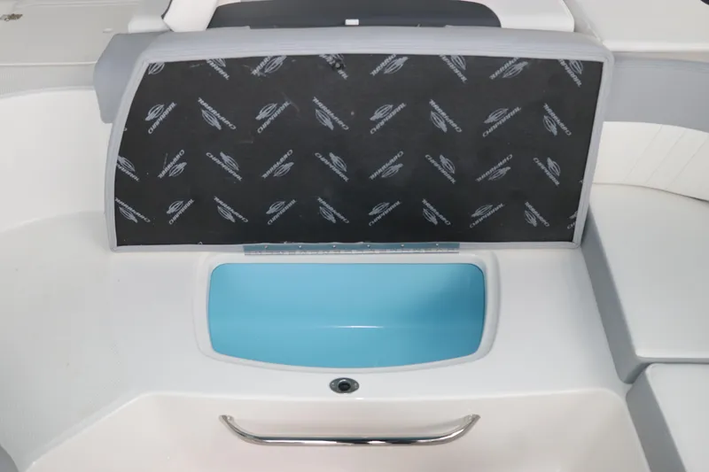 Slide: The Image of 2026 Chaparral 23 SSi OB boat interior with storage compartment and blue lining. - 22